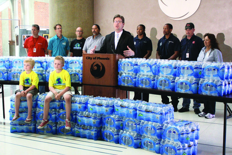 Greg Stanton makes a call for water